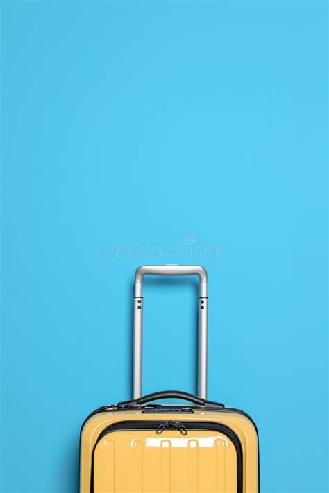 Packed Yellow Suitcase and Rack with Clothes Stock Photo - Image of ...