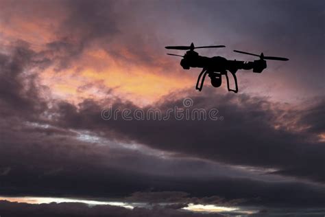 Innovation Concept. Silhouette of Drone Flying on Sunset Stock Image ...