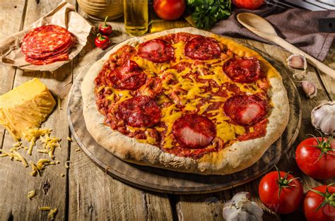 Rustic Salami Pizza With Cheddar Cheese And Chorizo 806259 Stock Photo