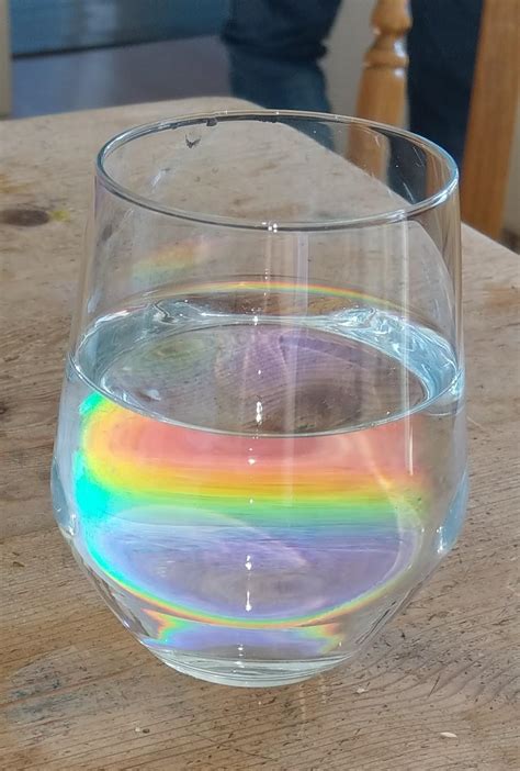 A rainbow on the table, viewed through a glass. : r/mildlyinteresting