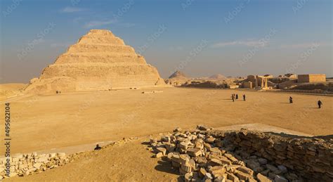 Saqqara, Cairo, Egypt - January 2022: Tourists in front of Pyramid of Djoser (Step Pyramid), is ...