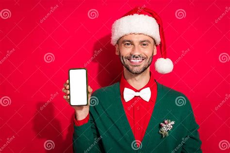 Photo Of Positive Cute Man Wear X Mas Bowtie Green Cardigan Rising Apple Samsung Modern Device