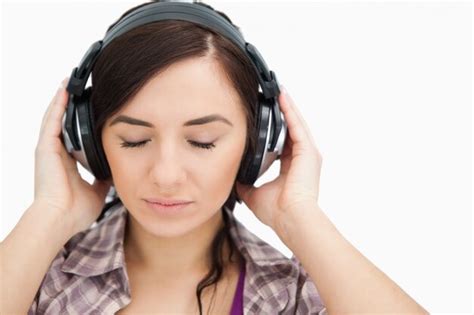 Premium Photo Brunette With Headphones Closing Her Eyes