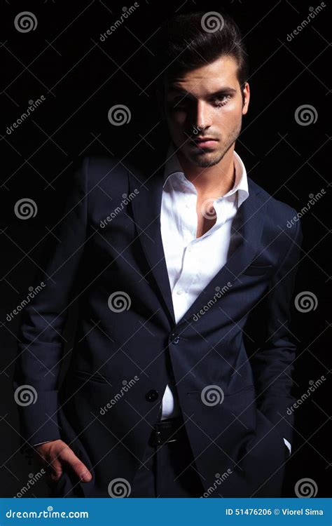 Handsome Business Man Posing On Black Studio Background Stock Photo