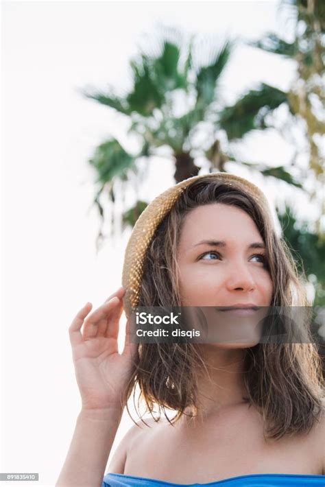 Beautiful Young Woman Summer Portrait On Beach Wearing Straw Hat Stock