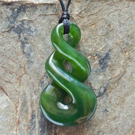 A Small Hand Crafted New Zealand Maori Style Carved Jade Double Twist