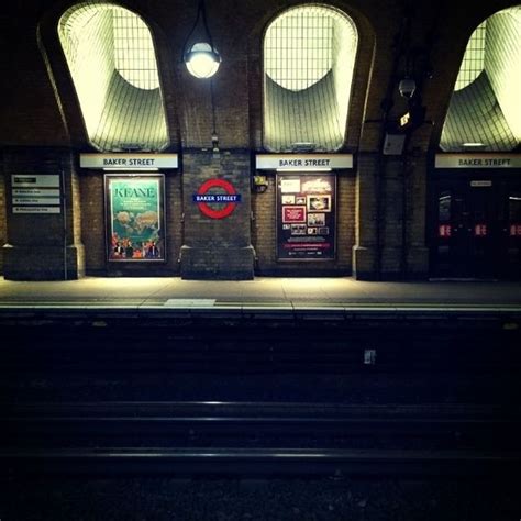 An Empty Train Station At Night With The Lights On