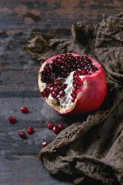 Premium Photo High Angle View Of Pomegranate On Table