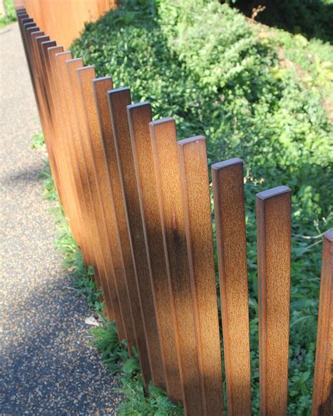 This Perfectly Aligned Curved Steel Rod Fence Was One Of The Many