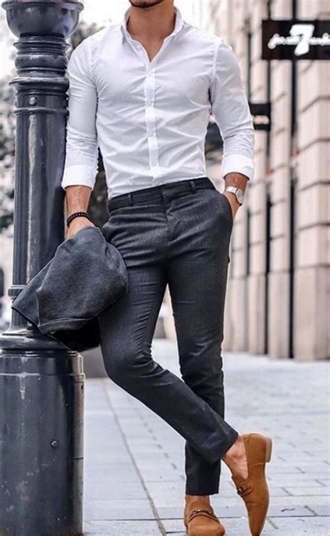 A Custom Made All White Mens Shirt And Well Fitting Charcoal Gray Pants