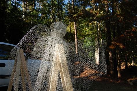 Angels Out Of Chicken Wire Sculpture In Forest