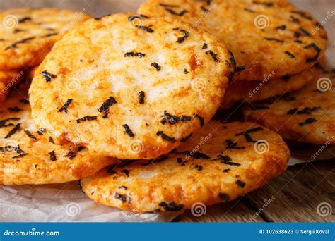 Japanese Crisp Snack Rice Cakes With Seaweed Macro On The Table Stock