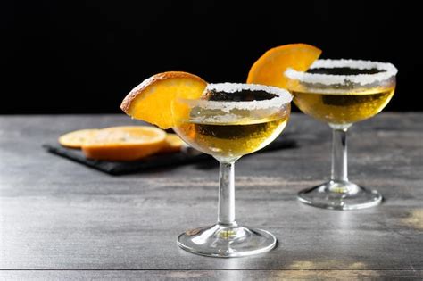 Premium Photo Sidecar Cocktail With A Sugar Rim On Wooden Table