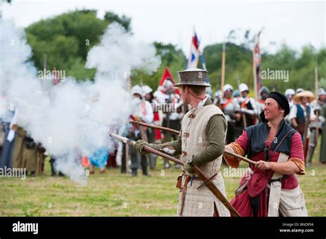 Medieval Male Gunner Firing A Handgonne On The Battlefield At The