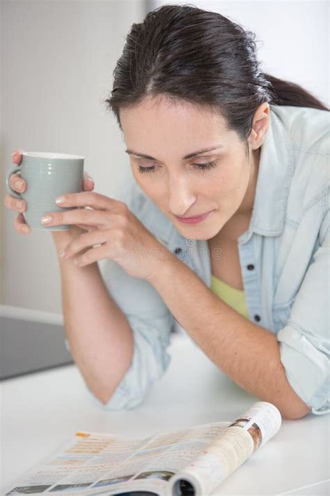 Woman Reading Magazine While Relaxing With Hot Drink Stock Photo Image Of Reading Gossip