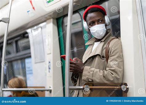 Afro American Passenger Man Standing In Subway Train Wear Face Medical