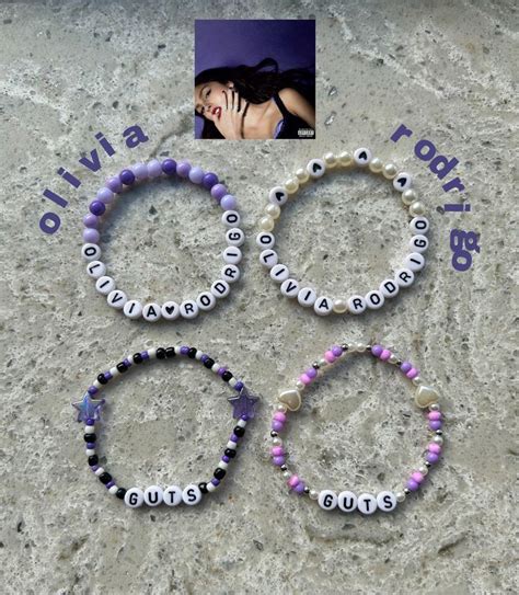 Three Bracelets With Beads And An Image Of A Woman S Face In The Background