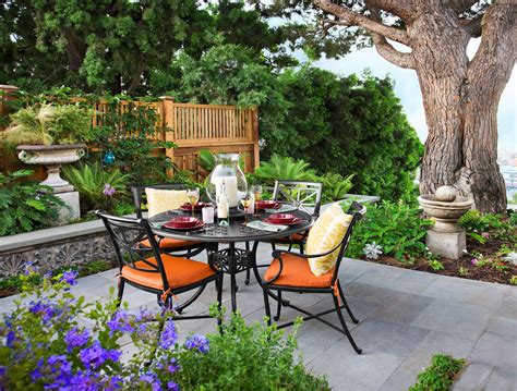 Create An Enticing Backyard Oasis With A Concrete Patio And Railing