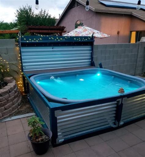 An Above Ground Swimming Pool Is Shown In The Back Yard With Lights