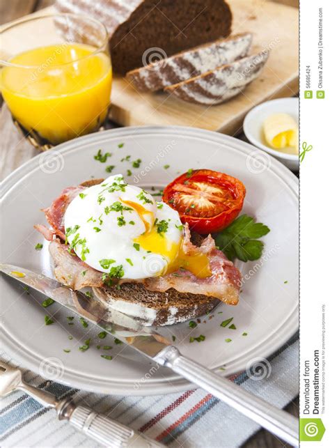 Poached Egg And Bacon On Rye Bread Healthy Breakfast Stock Photo