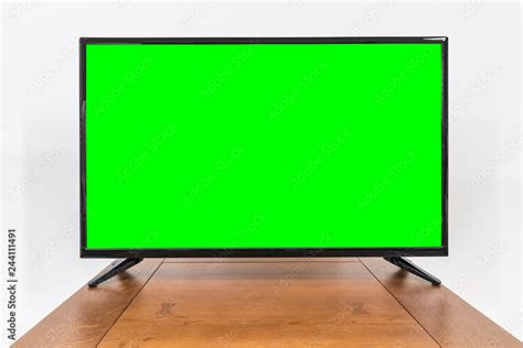 Modern television on old table with chroma key green screen. Stock Photo | Adobe Stock