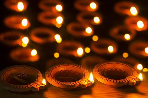 Close Up Burning Diya Oil Lamps Lighting Illuminated On Background