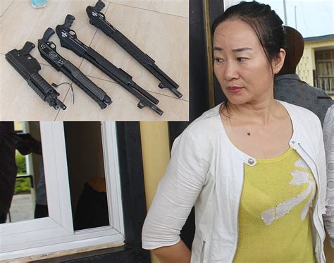 Chinese Woman Grabbed With Guns