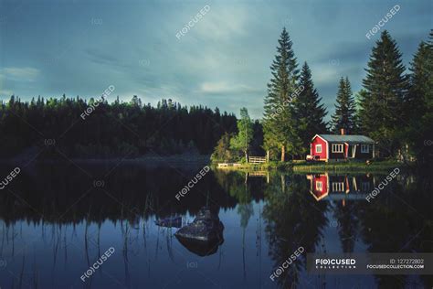 Small cabin by lake — natural light, Building Exterior - Stock Photo ...