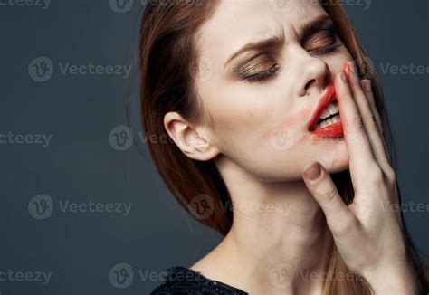 Charming woman smears lipstick all over her face 22061943 Stock Photo ...