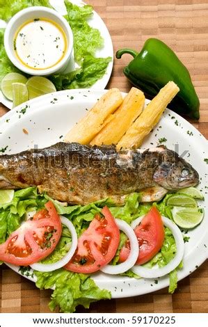 Ecuadorian Food Series Fried Fish On A Plate With Yucca And Salad