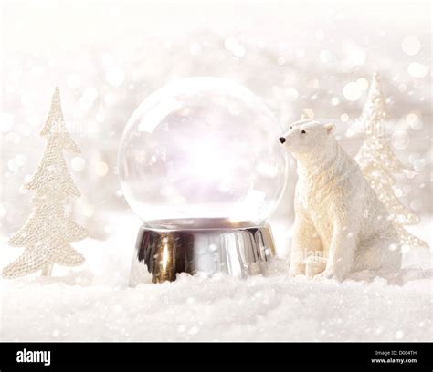 Snow globe in winter scene Stock Photo - Alamy
