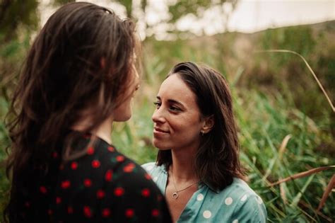 Premium Photo Close Up Of Lesbian Couple Looking At Each Other In Forest