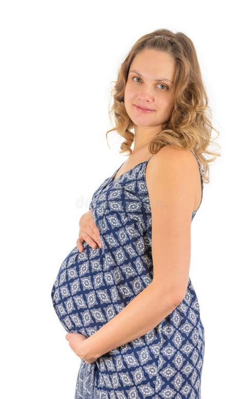 Ventre De Sourire De Fixation De Femme Enceinte Dans La Robe Photo