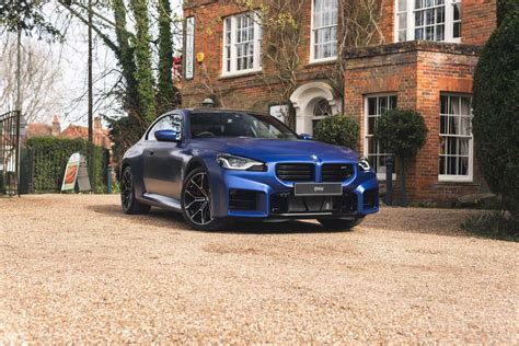 Two Bmw M2 Frozen Portimao Blue G87s Pose For The Camera