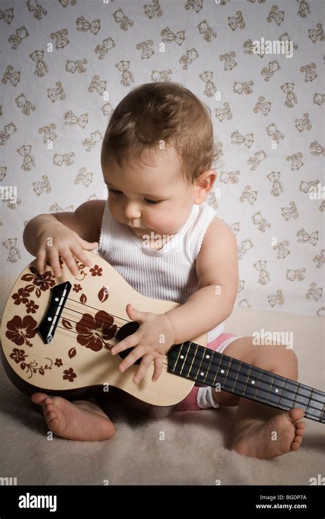 Baby with guitar Stock Photo - Alamy