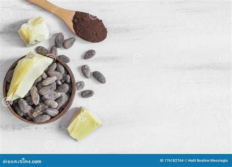 Cocoa Butter Or Cocoa Bean Solid Oil With Cacao Powder In Spoon And Raw