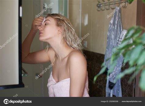 Beautiful Girl Blonde Taking Shower Cleans Face Makeup Cotton Disc