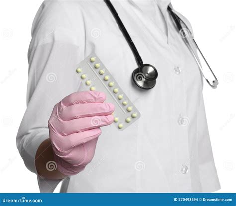 Doctor Holding Blister Of Oral Contraception Pills On White Background