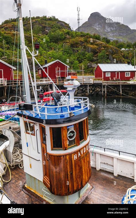 Fishing Boat With Traditional Red Wooden Houses Rorbuer In The Small