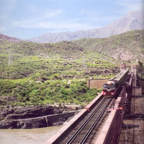 A Train Crossing A Bridge Over Indus River Near Attock Khurd Railway