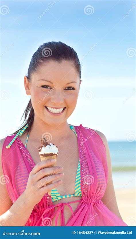 Glad Woman In Bikini Eating Ice Cream On The Beach Stock Image Image