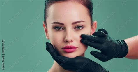 Slow Motion Clip Doctor Checks A Skin Before Plastic Surgery Face