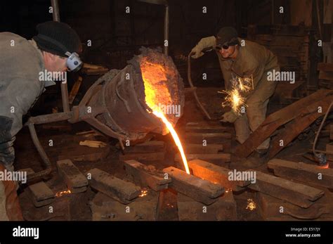 Molten steel pouring Stock Photo - Alamy