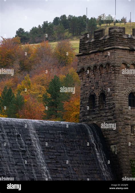 Derwent Dam with autumn trees and overflow Stock Photo - Alamy