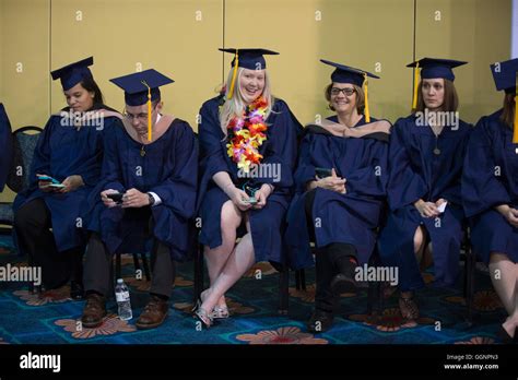 Graduation Candidates In Caps And Gowns Wait For Western Governors