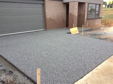 a house with a driveway and garage door