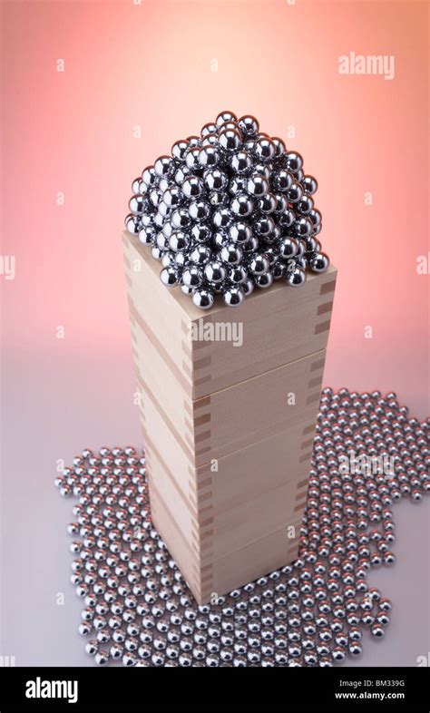 Heap of Pachinko balls in piled wooden box Stock Photo - Alamy