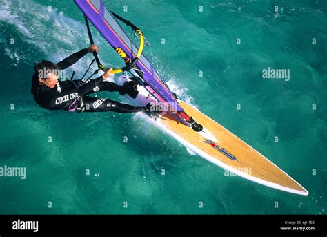 Aerial View Of Windsurfer On Sailing A Wood Effect Board On Clear