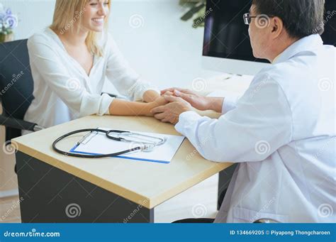 Hand Man Psychologist Doctor Reassuring To Happy Female Patient And