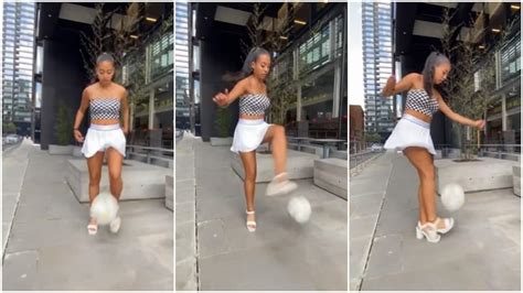 Lady On High Heels Shows Off Her Football Skill Raises Ball With Pro